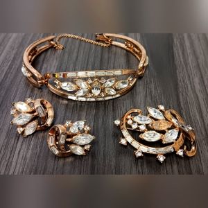 Trifari bracelet, earings, brooch